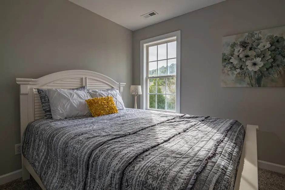 A bedroom with a bed and a window.